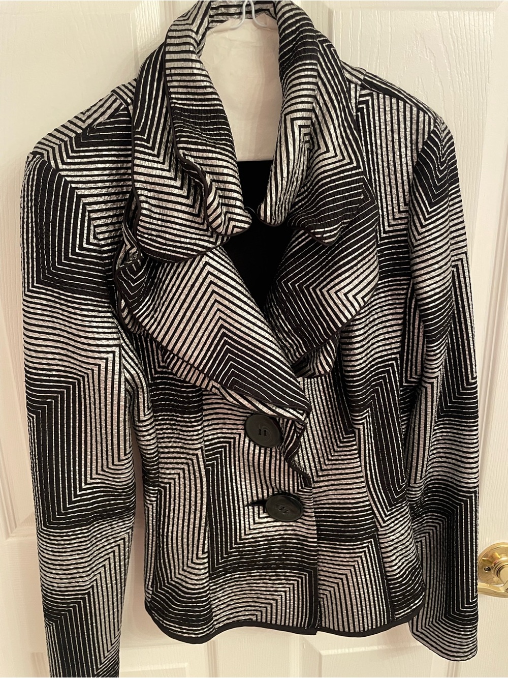 Joseph Ribkoff black and white geometric pattern jacket.